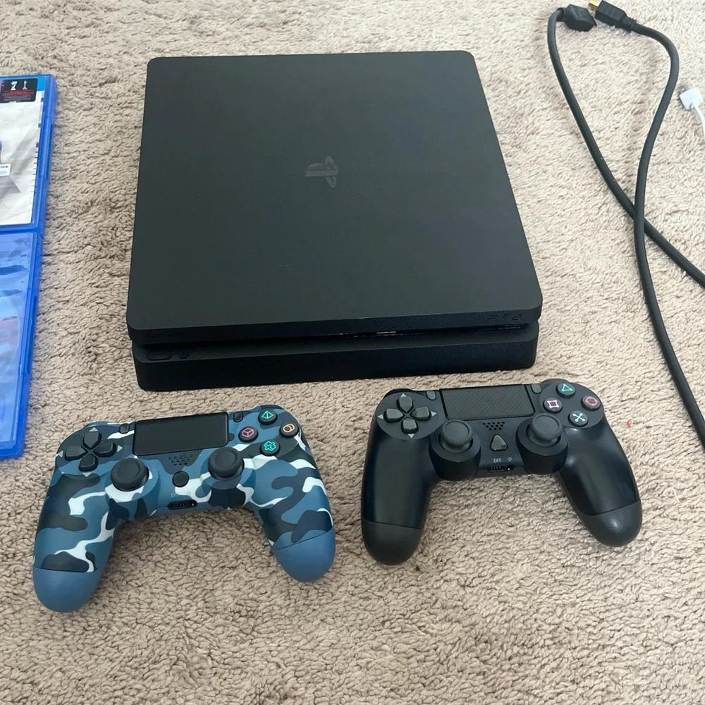 Sony PlayStation Console with Black and Blue Camouflage Controllers